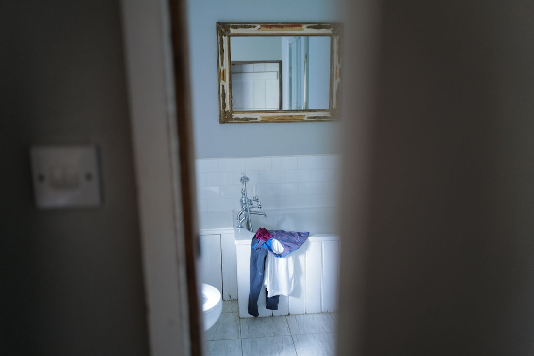 a bathroom with a mirror and a sink