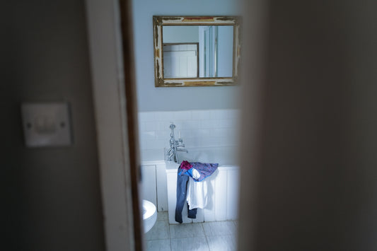 a bathroom with a mirror and a sink