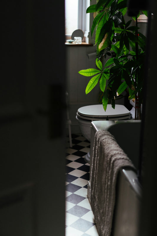 Bathroom with checkered floor and bathtub