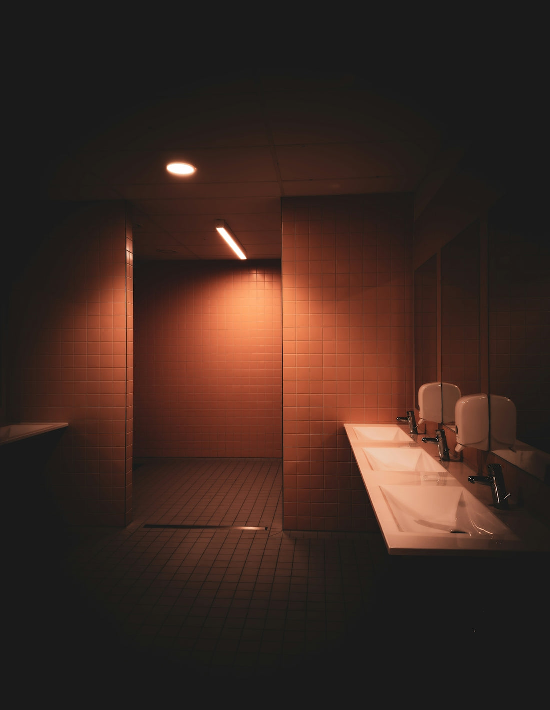 Modern bathroom with double sinks and tiled walls